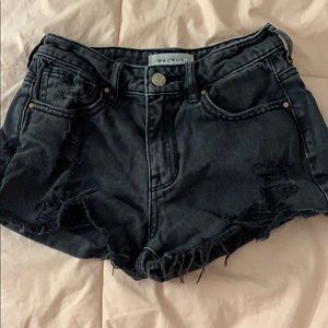 faded black ripped jean shorts